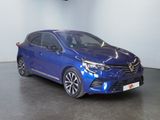 the blue car is parked in a large room with a black floor
