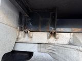 a close up view of a flatbed truck ' s rear end