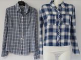 pair of blue and white plaid shirts on a mannequin display