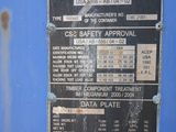 a sign on the side of a blue machine
