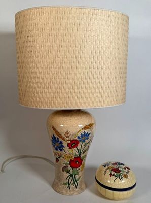 a lamp that is sitting next to a small box