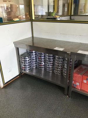 a large metal table with a bunch of cans on it