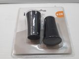 two black plastic cups sitting on top of a white table