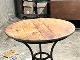 a table that has a wooden top on it