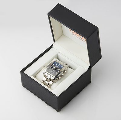 a watch in a black box on a white surface