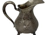 an image of a silver pitcher with a handle on a white background