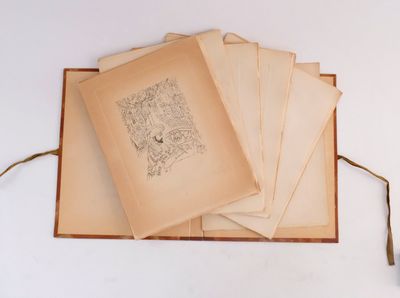several old books are stacked on top of each other on a table