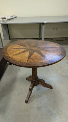 a wooden table with a star design on it
