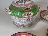 a tea pot and two cups on a table