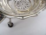 a silver bowl that is sitting on a table