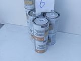 several cans of paint are stacked on top of each other