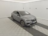 the grey car is parked in a white room with a black and white checkered floor