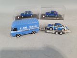 two toy cars and a truck in a display case