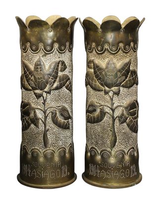 pair of antique brass vases with flowers and leaves on them