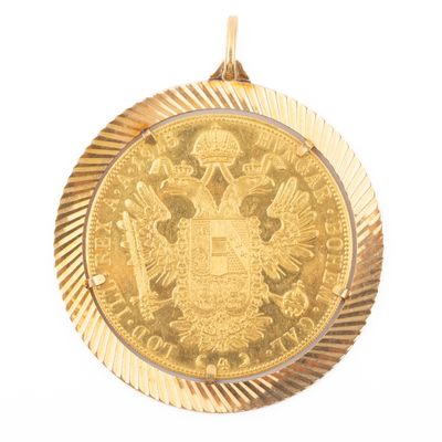 l'image d'une pièce d'or sur laquelle figurent des armoiries