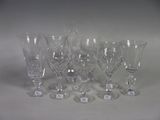 a lot of wine glasses sitting on a table