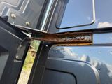 a close up of a door handle on a truck