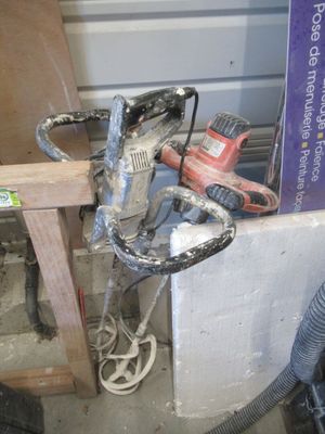 a picture of a drill and a sander in a room