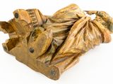 a wooden sculpture of a man on a motorbike