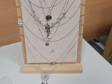 a display of necklaces and bracelets on a table