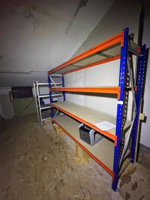 a room that has a shelf in it with a lot of shelves
