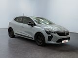 a silver car parked in a white room with a black floor