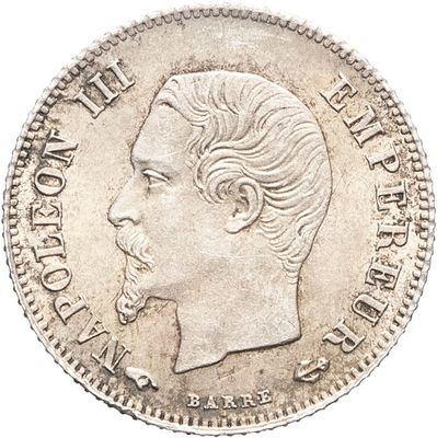 Gros plan sur une pièce de monnaie portant le visage d'un homme