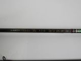 a close up of a fishing rod on a white surface