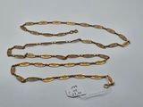 a collection of five gold chains