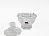 clear glass bowl with lid and lid on white background