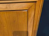 a close up of a wooden cabinet with a drawer