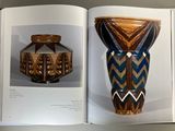 an open book with a picture of a vase and a picture of a vase