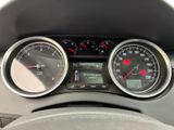 a close up of a car dashboard with gauges and speedometers