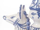 two blue and white vases that have animals on them