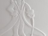a close up of a drawing of a man and woman on a wall