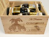 bottles of wine in a wooden box on a white surface