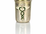 an image of a gold cup with a green snake on it