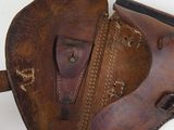 an overhead view of a brown leather shoe with a brown strap