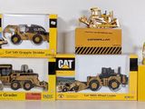 a lot of toy vehicles that are sitting on a table