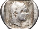 a silver coin with an image of a man ' s face on it