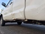 a white truck that is parked on the side of the road