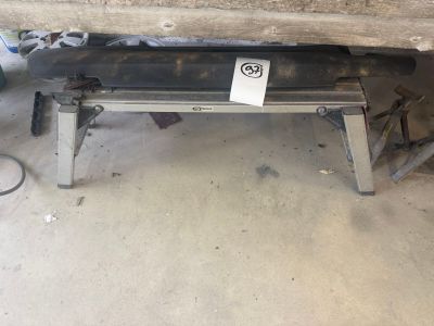 a bench that is under a car in a garage