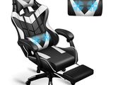 a black and white gaming chair with a blue light on it