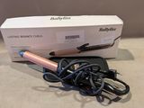 a box with a hair dryer and a cord on the table