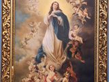 a painting of the virgin surrounded by angels and chers
