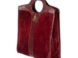 an image of a red handbag with a handle on a white background