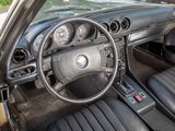 a car dashboard with a steering wheel and a dash board