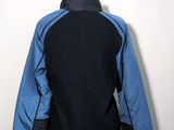 the back of a blue and black jacket on a mannequin mannequin