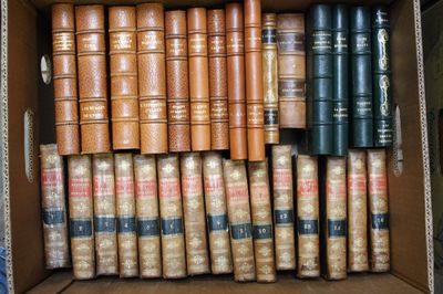 a box full of old books sitting on top of a table