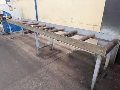 a long table that has a bunch of pipes on it
